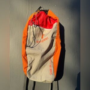 Cotopaxi Luzon Eighteen 18L Lightweight Daypack in Light Grey, Orange and Red